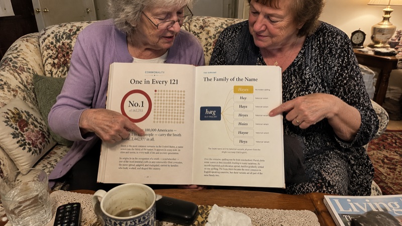Joan Hayes and her sister reading the report